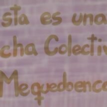 Cartel apoyando la lucha contra la pandemia en una ventana.